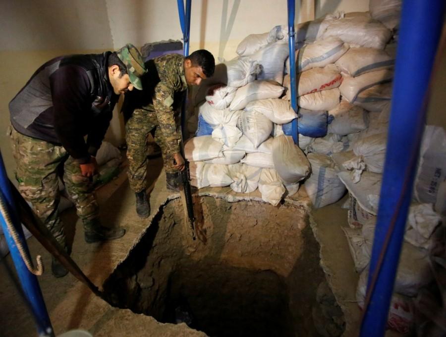 Iraqi soldiers inspect a tunnel used by Islamic State militants during a battle with Islamic State, north of Mosul. Second phase of Mosul,Mosul,Mosul offensive begins,Islamic State militants,Iraqi security forces,Islamic State,Battle of Mosul