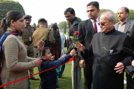 Children greet President Pranab Mukherjee on New Year in New Delhi, on Jan 1, 2017.