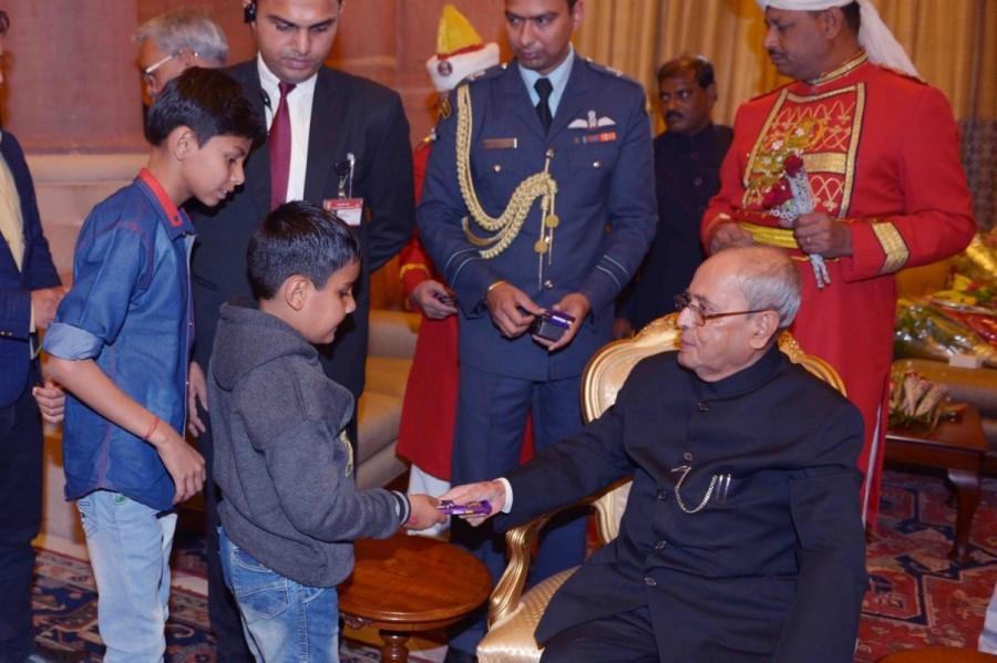Children greet President Pranab Mukherjee on New Year in New Delhi, on Jan 1, 2017. President Pranab Mukherjee,Pranab Mukherjee,Children greet President Pranab Mukherjee,Children greet Pranab Mukherjee,Pranab Mukherjee new year,Pranab Mukherjee new year celebrations,Pranab Mukherjee new year celebrations pics,Pranab Mukherjee new year ce
