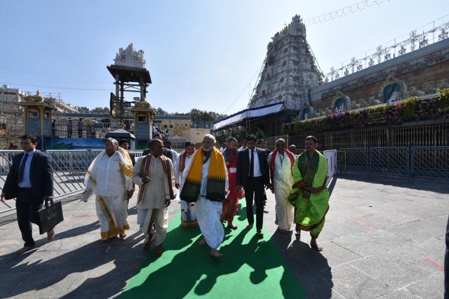 Prime Minister Narendra Modi offer prayers at the Sri Venkateswara Swamy Temple during his Tirupati visit on Wednesday. Narendra Modi offers prayers to Lord Venkateswara Swamy,Narendra Modi at Lord Venkateswara Swamy,Narendra Modi at Tirupati,Narendra Modi visits Tirupati,Narendra Modi offers prayers Tirupati,Narendra Modi offer prayers Tirupati