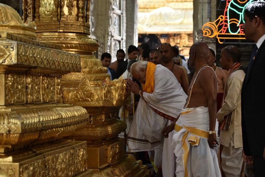 Prime Minister Narendra Modi offer prayers at the Sri Venkateswara Swamy Temple during his Tirupati visit on Wednesday. Narendra Modi offers prayers to Lord Venkateswara Swamy,Narendra Modi at Lord Venkateswara Swamy,Narendra Modi at Tirupati,Narendra Modi visits Tirupati,Narendra Modi offers prayers Tirupati,Narendra Modi offer prayers Tirupati