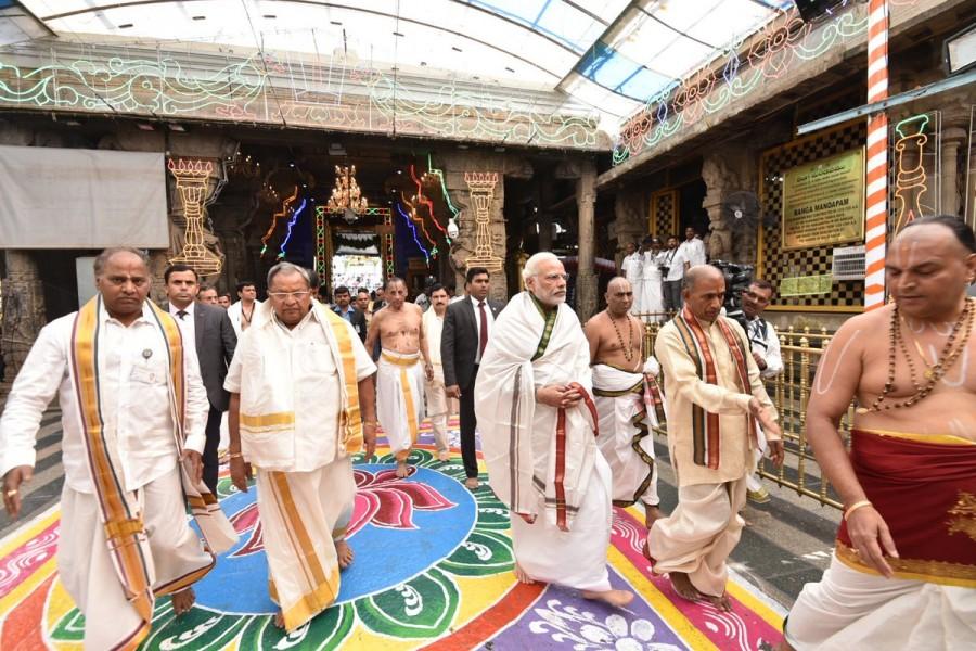 Prime Minister Narendra Modi offer prayers at the Sri Venkateswara Swamy Temple during his Tirupati visit on Wednesday. Narendra Modi offers prayers to Lord Venkateswara Swamy,Narendra Modi at Lord Venkateswara Swamy,Narendra Modi at Tirupati,Narendra Modi visits Tirupati,Narendra Modi offers prayers Tirupati,Narendra Modi offer prayers Tirupati