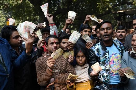 People stage a demonstration outside the Reserve Bank of India (RBI) building after the apex bank turned away people trying to exchange old currency notes in New Delhi on Jan 3, 2017.