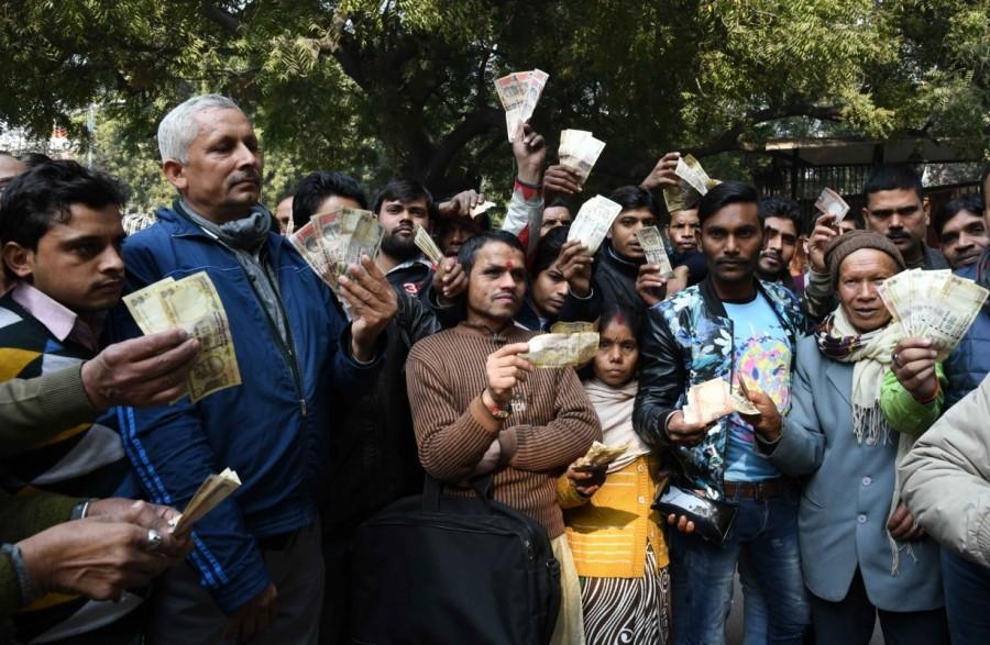 People stage a demonstration outside the Reserve Bank of India (RBI) building after the apex bank turned away people trying to exchange old currency notes in New Delhi on Jan 3, 2017. Protests outside RBI,Reserve Bank of India,old currency notes,old notes,exchange old currency notes,demonetisation,apex bank