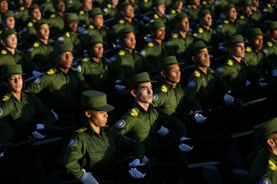 Soldiers march to mark the Armed Forces Day and commemorate the landing of the yacht Granma. Cuba,Cuba parades troops,Granma yacht,Castro brothers,60th anniversary of the landing of the Granma yacht,strength of Granma yacht,Mexico to Cuba,Armed Forces Day
