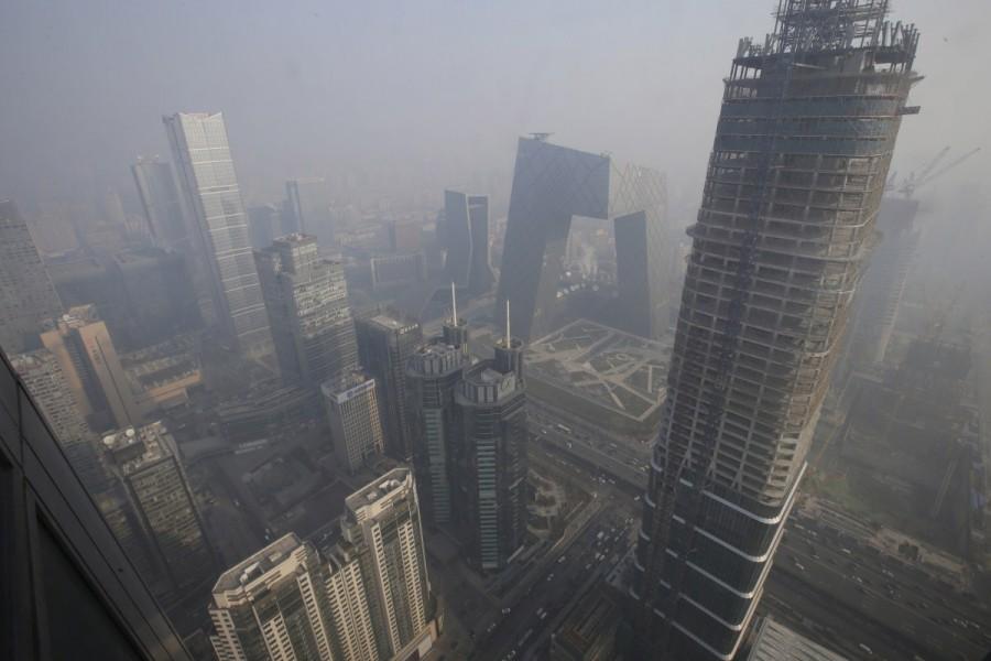 Buildings are pictured amid the smog in Beijing's central business district. China,China smoggy skies,smoggy skies,soil and water,economic growth