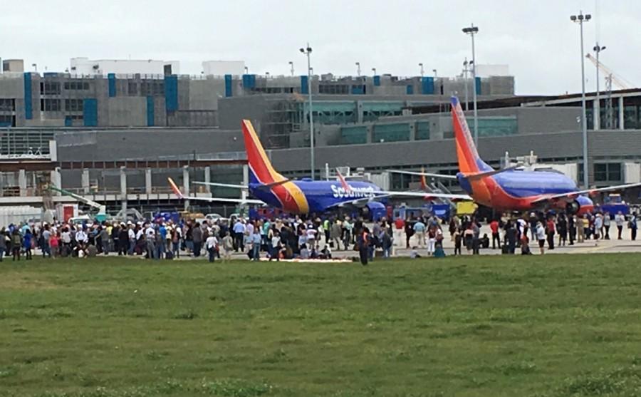 Travelers are evacuated out of the terminal and onto the tarmac after a shooting at Fort Lauderdale-Hollywood International Airport in Florida, January 6, 2017. Fort Lauderdale airport,Shooting at Fort Lauderdale airport,Fort Lauderdale airport shooting,gunman,Fort Lauderdale-Hollywood International Airport