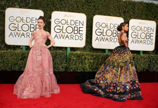 Actresses Lily Collins (L) and Olivia Culpo arrive at the 74th Annual Golden Globe Awards