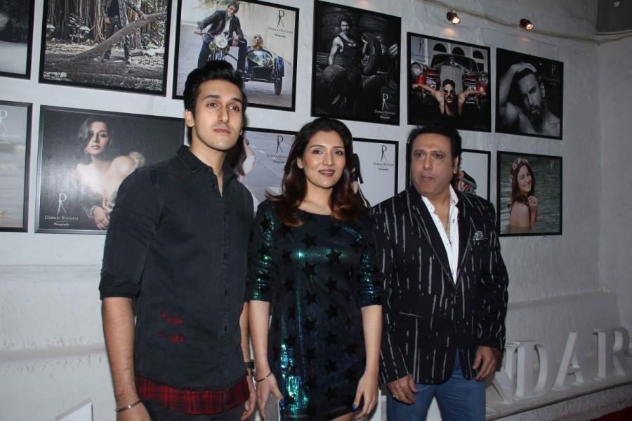 Bollywood actor Govinda with his daughter Tina Ahuja and son Yashvardan Ahuja during the launch of Fashion Photographer Dabboo Ratnanis 2017 calendar in Mumbai. Govinda,AR Rahman,Tiger Shroff,Kriti Sanon,Varun Dhawan,Dabboo Ratnani,Dabboo Ratnani calendar launch,Dabboo Ratnani calendar launch pics,Dabboo Ratnani calendar launch 2017,Dabboo Ratnani calendar 2017,Dabboo Ratnani calendar launch images,Dabboo Ratnani