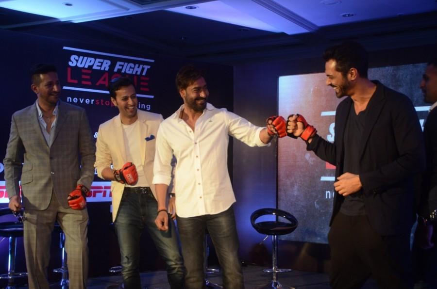 Ajay Devgan and Arjun Rampal during a Super Fight League programme in Mumbai, on Jan 13, 2017 Super Fight League is a Mixed Martial Arts competition. Ajay Devgan & Arjun Rampal,Ajay Devgan,Arjun Rampal,Super Fight League programme,Super Fight League,Mixed Martial Arts competition,Mixed Martial Arts