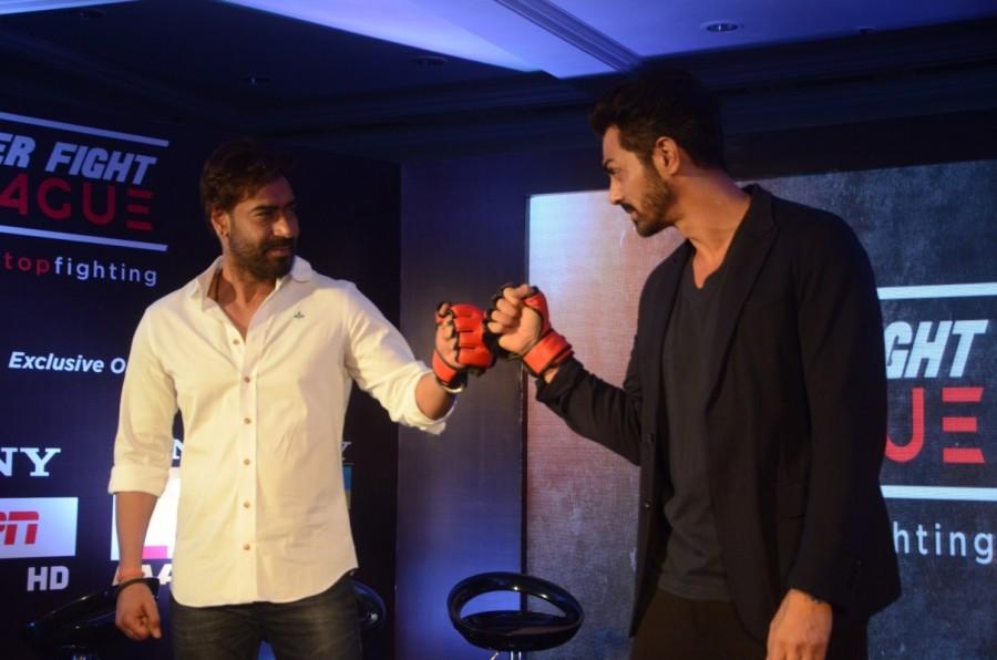 Ajay Devgan and Arjun Rampal during a Super Fight League programme in Mumbai, on Jan 13, 2017 Super Fight League is a Mixed Martial Arts competition. Ajay Devgan & Arjun Rampal,Ajay Devgan,Arjun Rampal,Super Fight League programme,Super Fight League,Mixed Martial Arts competition,Mixed Martial Arts
