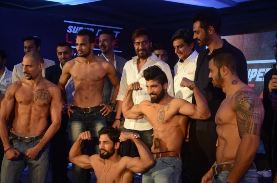 Ajay Devgan and Arjun Rampal during a Super Fight League programme in Mumbai, on Jan 13, 2017 Super Fight League is a Mixed Martial Arts competition. Ajay Devgan & Arjun Rampal,Ajay Devgan,Arjun Rampal,Super Fight League programme,Super Fight League,Mixed Martial Arts competition,Mixed Martial Arts