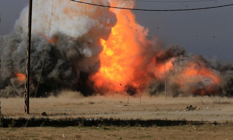 Cloud of smoke rises from a car bomb belonging to Islamic State militants after a controlled explosion by the Iraqi Federal police, during clashes with Islamic State militants, eastern Mosul, Iraq, January 13, 2017. Mosul,War in Mosul,Iraqi forces,State block,eastern Mosul