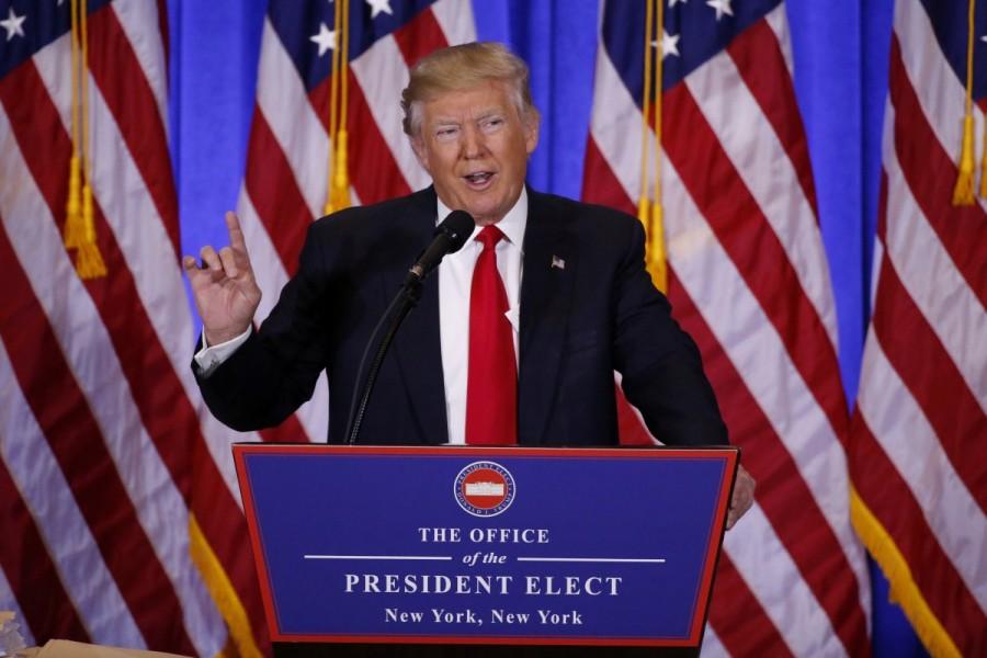 President-elect Donald Trump speaks during a news conference in the lobby of Trump Tower in Manhattan, New York City, January 11, 2017. Donald Trump,Donald Trump first news conference,president Donald Trump,President-elect Donald Trump,Manhattan,Trump Tower