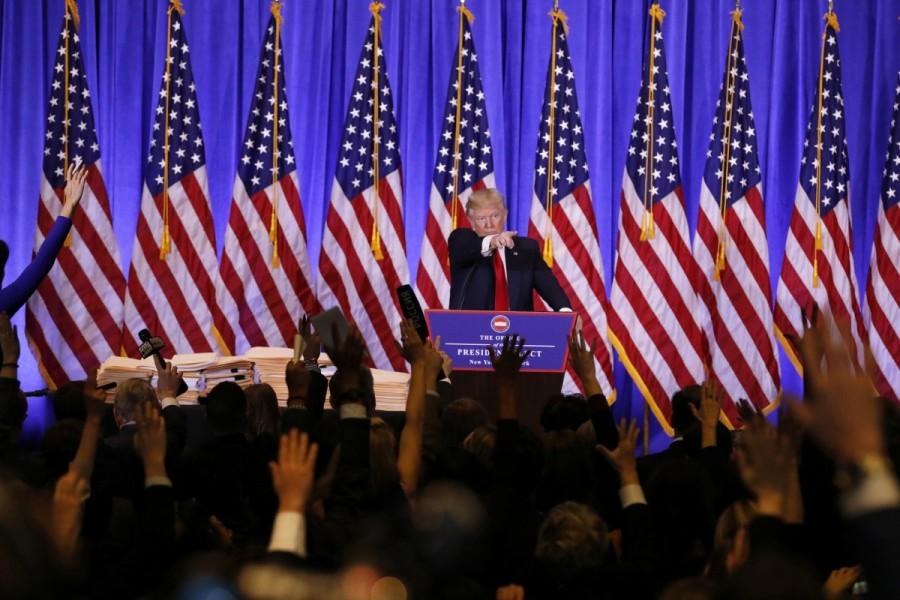 U.S. President-elect Donald Trump calls on reporters during a news conference in the lobby of Trump Tower in Manhattan, New York City, U.S., January 11, 2017. Donald Trump,Donald Trump first news conference,president Donald Trump,President-elect Donald Trump,Manhattan,Trump Tower