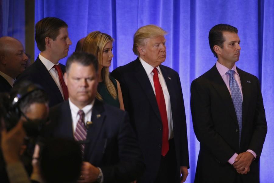 President-elect Donald Trump waits with his children before speaking during a news conference in the lobby of Trump Tower in Manhattan. Donald Trump,Donald Trump first news conference,president Donald Trump,President-elect Donald Trump,Manhattan,Trump Tower