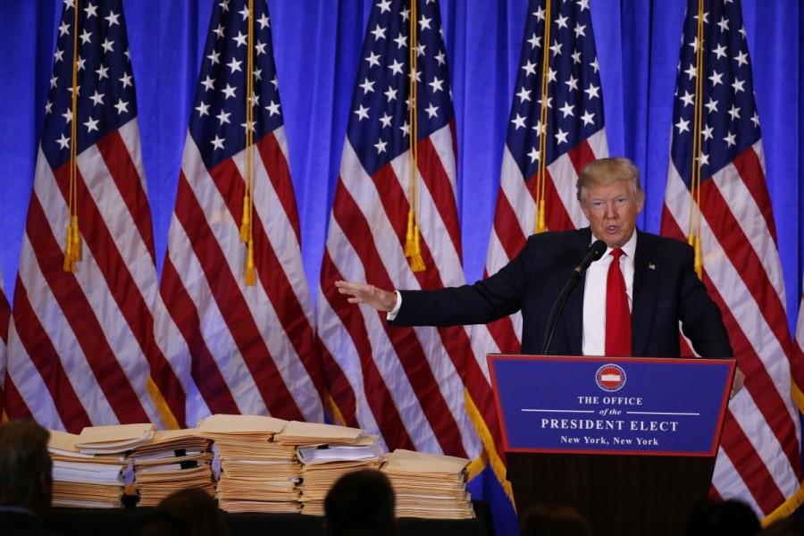 President-elect Donald Trump speaks during a news conference in the lobby of Trump Tower in Manhattan. Donald Trump,Donald Trump first news conference,president Donald Trump,President-elect Donald Trump,Manhattan,Trump Tower