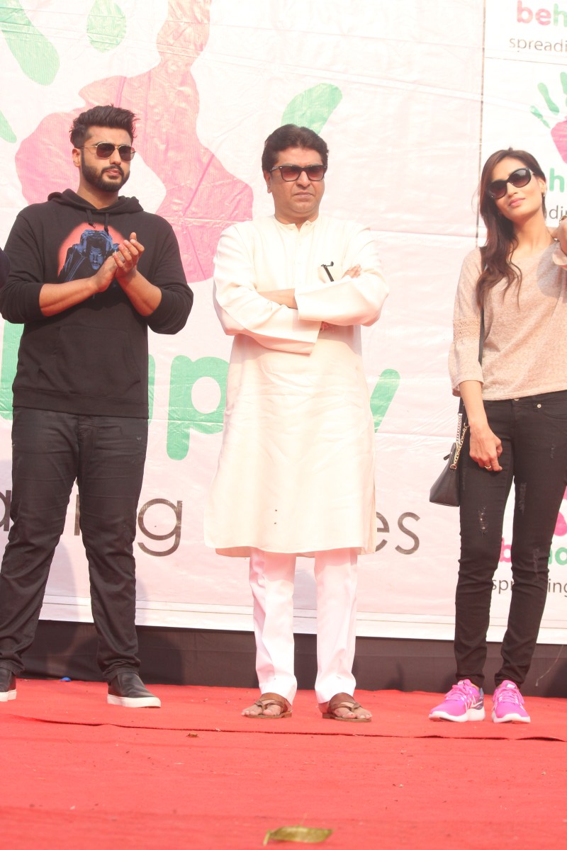 Maharashtra Navnirman Sena (MNS) president Raj Thackeray, actors Arjun Kapoor and Priya Wal during the Lokhandwala Street Festival. Actors Arjun Kapoor,Raj Thackeray,Arjun Kapoor,Priya Wal,Lokhandwala street festival,Lokhandwala street festival pics,Lokhandwala street festival images,Lokhandwala street festival photos,Lokhandwala street festival stills,Lokhandwala street festival pict