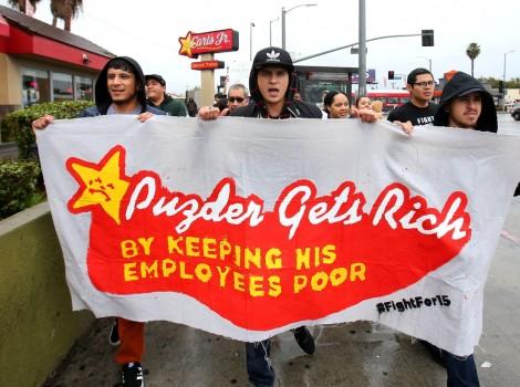 Local fast food workers take part in nationwide protests to denounce President-elect Donald Trump's nomination of Andy Puzder, a restaurant mogul who owns Carl's Jr. and other chains, as Secretary of Labor outside a Carl's Jr. restaurant in Los Angeles, California.