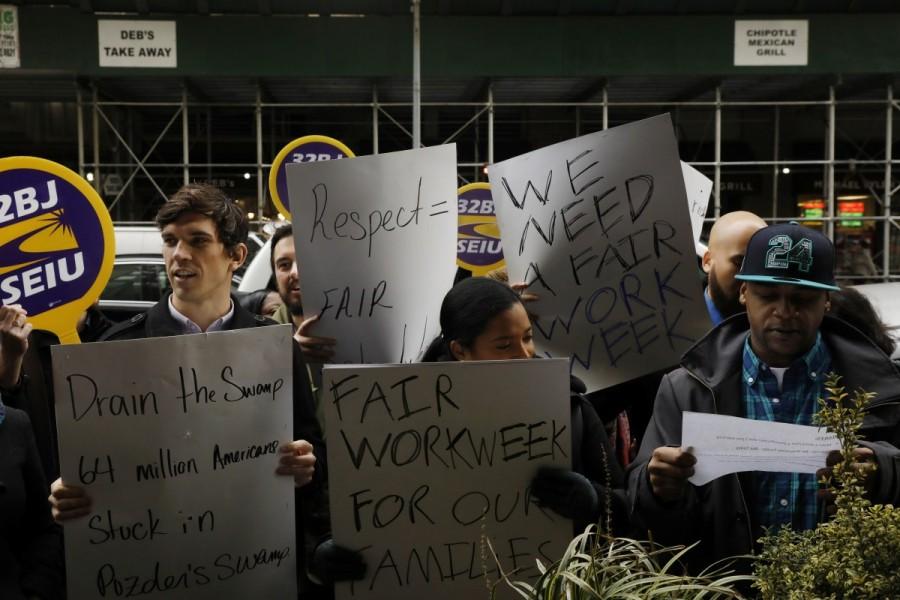 Demonstrators protest the nomination of Chief executive officer of CKE Restaurants, Andy Puzder, as Secretary of Labor in New York. Donald Trump,Fight for $15,labor secretary nominee,Donald Trump labor secretary nominee,President-elect Donald Trump,against Andrew Puzder,Andrew Puzder