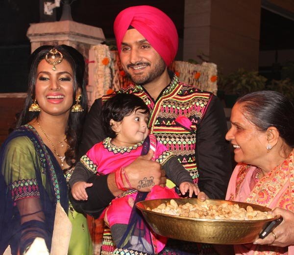 Photos of Harbhajan Singh and Geeta Basra celebrate Lohri festival with daughter Hinaya. Harbhajan Singh and Geeta Basra,Harbhajan Singh,Geeta Basra,daughter Hinaya,Hinaya,Lohri festival,Lohri festival celebrations,Harbhajan Singh with daughter Hinaya,Harbhajan Singh with Hinaya,Geeta Basra with daughter Hinaya,Geeta Basra with Hinaya