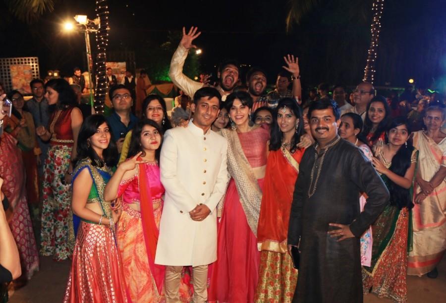 Taapsee Pannu decked as a barati looking pretty in pink and red took an entire wedding function by surprise when she almost gatecrashed a wedding ceremony. At a suburban hotel in Mumbai, with limited intimation to the bride's parents, Taapsee Pannu reached decked in Indian attire to surprise the to be bride and groom who were celebrating their traditional sangeet ceremony. Taapsee Pannu,actress Taapsee Pannu,RunningShaadi,music of RunninShaadi,wedding ceremony,Bollywood actress Taapsee Pannu