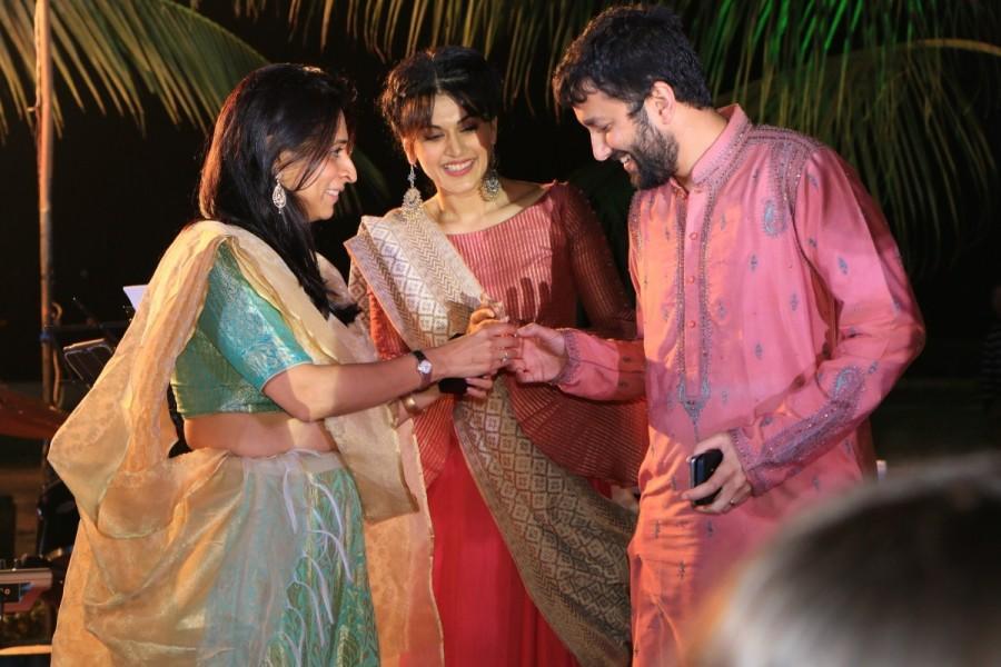 To everyone's surprise including the guests and the pair, Taapsee intruded the event, shutting down the Music and soon took centre stage explaining everyone the purpose of her visit. The intrigued guests gathered and Taapsee invited the guests to shake a leg with her on the song of her soon to be released film - RunningShaadi.com with Amit Sadh. The song titled Dimpy De Naal Bhaage Bunty was the first song released last week from the movie and already garnered close to two million views since then. Sung by the vocals of the iconic punjabi singer, Late Labh Janjua, the guests and the family danced with much joy with Taapsee. Taapsee Pannu,actress Taapsee Pannu,RunningShaadi,music of RunninShaadi,wedding ceremony,Bollywood actress Taapsee Pannu