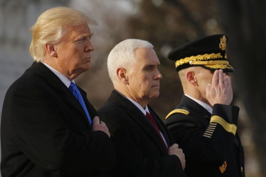 U.S. President-elect Donald Trump and Vice President-elect Mike Pence participate in a wreath laying ceremony at the Tomb of the Unknowns in Arlington National Cemetery outside Washington, U.S., January 19, 2017, one day before Trump's inauguration as the nation's 45th president. Donald Trump,Mr. Trump,Donald Trump at Washington,President-elect Mr. Trump