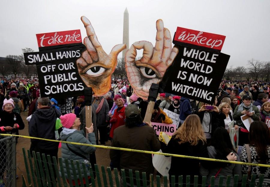 Banners are held aloft during Women’s March on Washington. Donald Trump,President Donald Trump,Women march on Washington,Women march,United States,protest against Donald Trump
