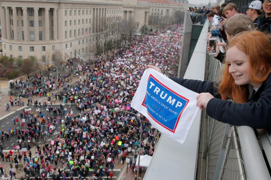 Sixteen year-old Emma Humphries holds a "Trump" towel over the Women's March on Washington. Donald Trump,President Donald Trump,Women march on Washington,Women march,United States,protest against Donald Trump