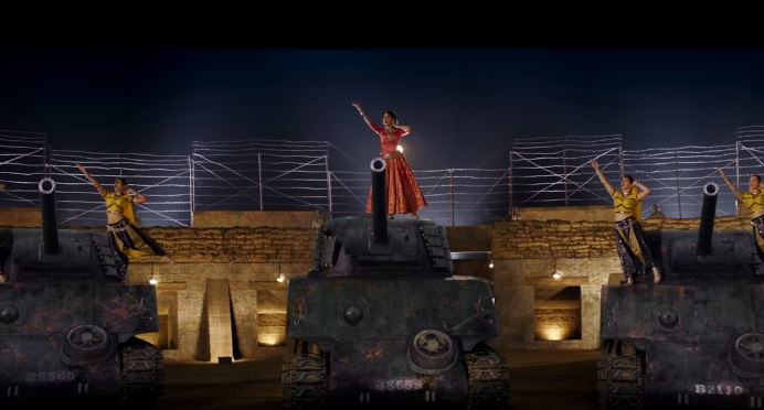 'Mere Miyan Gaye England' has a desi appeal to it and it is entertaining to watch the feisty 'Julia,' dressed in Indian wear and going all out in captivating the audience with her desi thumkas on the stage made of tanks. The song is colorful and has many dancers accompanying Kangana as she showcases her storytelling skills with endearing expressions. Sung by Rekha Bharadwaj, music composed by Vishal Bharadwaj and lyrics penned down by the veteran Gulzar, 'Mere Miyan Gaye England' is an ode to the classic 'Mere Piya Gaye Rangoon' from the 1940's era. Rangoon,Kangana Ranaut,Mere Miyan Gaye England,actress Kangana Ranaut,Kangana Ranaut dancing