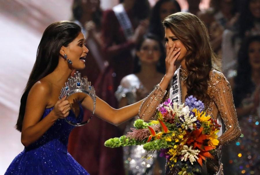Pia Wurtzbach holds the crown as she rushes towards Miss France Iris Mittenaere after the latter was declared winner in the 65th Miss Universe beauty pageant at the Mall of Asia Arena, in Pasay, Metro Manila, Philippines January 30, 2017. Iris Mittenaere,Iris Mittenaere Crowned Miss Universe 2016,Miss Universe 2016,Miss Universe,miss universe 2016 winner,miss universe 2016 photos,Miss Universe 2016 pics,Iris Mittenaere pics,Iris Mittenaere images,Iris Mittenaere photos,Iris Mittenaere stil