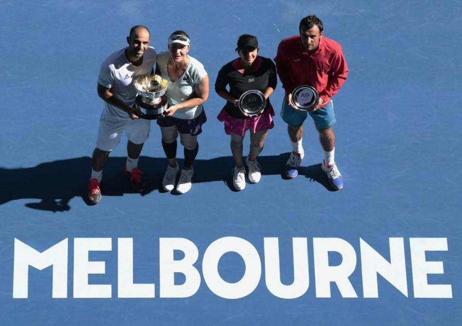 Abigail Spears of the U.S. and Colombia's Juan Sebastian Cabal pose with their trophy after winning their Mixed doubles final match against India's Sania Mirza and Croatia's Ivan Dodig. Australian Open,Australian Open 2017,Abigail Spears-Jan Sebastian Cabal,Abigail Spears,Jan Sebastian Cabal,Saina Mirza-Ivan Dodig,Saina Mirza,Ivan Dodig,mixed doubles final