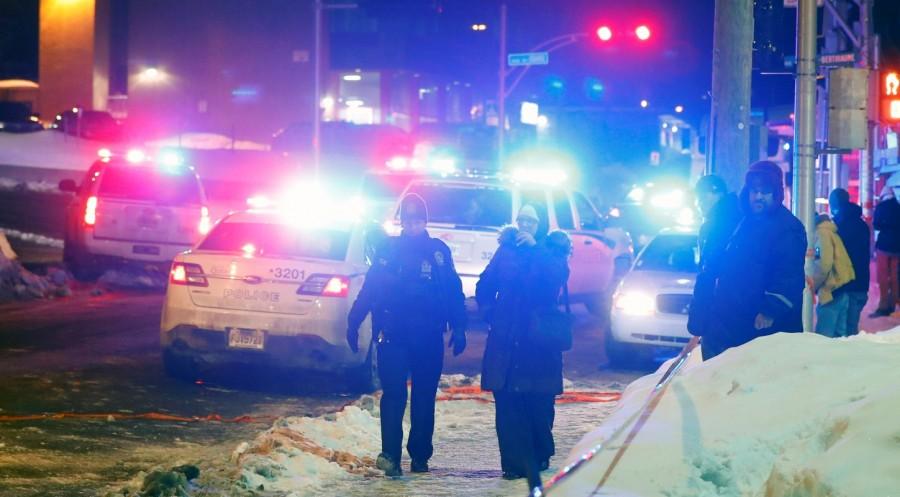 Police officers are seen near a mosque after a shooting in Quebec City, January 29, 2017. Five people were killed after gunmen opened fire in a Quebec City mosque, the mosque's president told reporters. A witness told Reuters that up to three gunmen fired on about 40 people inside the Quebec City Islamic Cultural Centre. Deadly shooting,shooting at Quebec mosque,Quebec mosque,Quebec City mosque,evening prayers