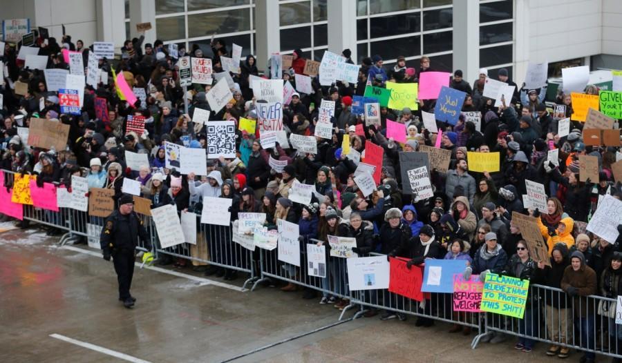 Hundreds of people rally against a temporary travel ban signed by U.S. President Donald Trump in an executive order during a protest at Detroit Metropolitan airport in Romulus. #NoMuslimBan,No Muslim Ban,NoMuslimBan,Trump's travel ban,Donald Trump,Protests erupt over Donald Trump,Muslim,Muslim ban