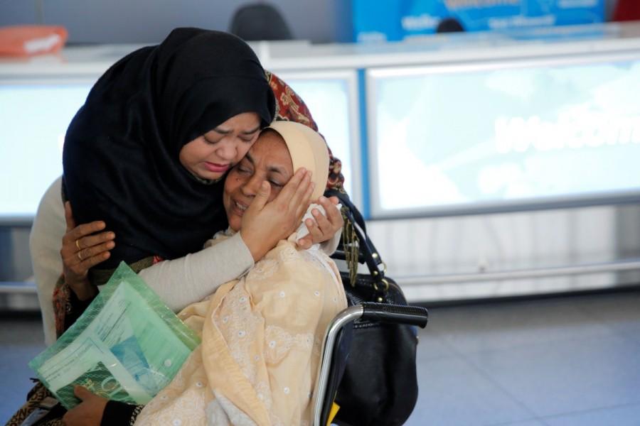 A woman greets her mother after she arrived from Dubai on Emirates Flight 203 at John F. Kennedy International Airport in Queens, New York, January 28, 2017. Trump,Donald Trump,Muslim immigrants,Muslim immigrants ban,ban Muslim immigrants,United States,President Trump,U.S.-bound flights