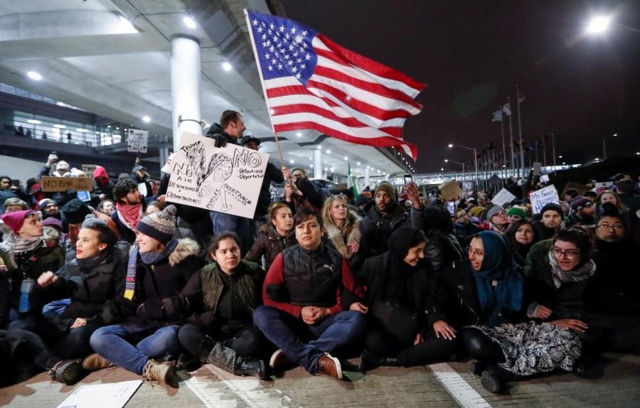People gather to protest against the travel ban imposed by U.S. President Donald Trump's executive order, at O'Hare airport in Chicago. Trump,Donald Trump,Muslim immigrants,Muslim immigrants ban,ban Muslim immigrants,United States,President Trump,U.S.-bound flights