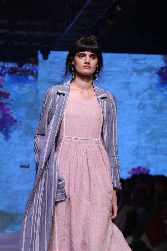 A model displays the creation of fashion during the Lakme Fashion Week Summer/Resort 2017, in Mumbai on February 1, 2017. Kiran Rao,Kiran Rao at Lakme Fashion week,Lakme Fashion week,Lakme Fashion week day 1,Lakme Fashion week pics,Lakme Fashion week images,Lakme Fashion week photos,Lakme Fashion week stills,Lakme Fashion week pictures