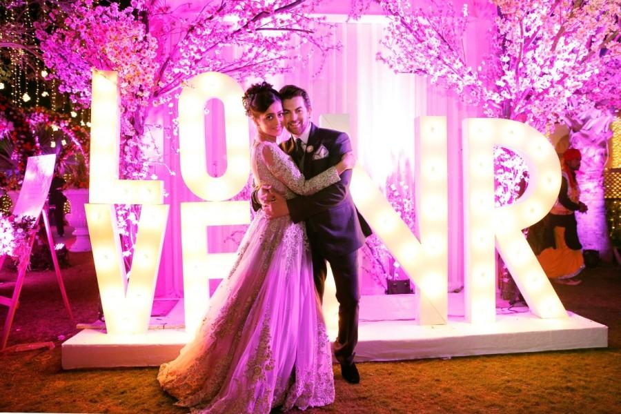 Neil Nitin Mukesh-Rukmini Sahay wedding commenced on a high note. It was a beautiful sight to watch Neil Nitin Mukesh, Nitin Mukesh, Nishi Mukesh, Naman Mathur and Neha Swarup shake a leg to the tunes of Indian classical flute and dhol whilst greeting each of their guests who got a scented welcome with rose petal showers from the towering balconies of Radisson Blu Hotel. Neil Nitin Mukesh and Rukmini Sahay,Neil Nitin Mukesh,Rukmini Sahay,Neil Nitin Mukesh wedding pics,Neil Nitin Mukesh wedding images,Neil Nitin Mukesh wedding photos,Neil Nitin Mukesh wedding stills,Neil Nitin Mukesh wedding pictures