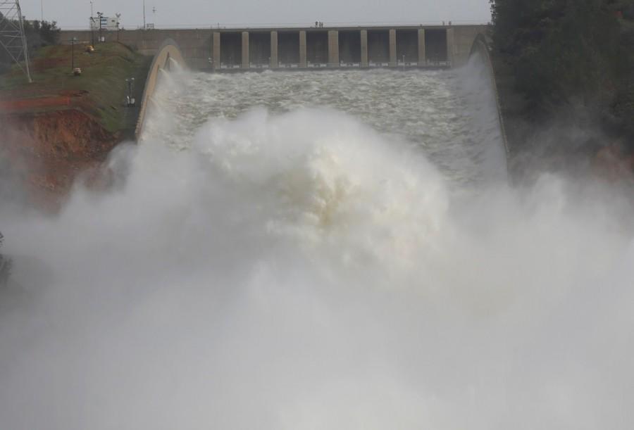 Staff with the California Department of Water Resources watch as water is released from the Lake Oroville Dam after an evacuation was ordered for communities downstream from the dam in Oroville, California. California dam,California dam threatens,America,America's tallest dam,Northern California winter