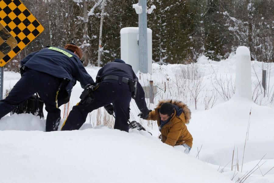 The Yemeni man then fell and needed to be helped up the hill at the U.S.-Canada border into Hemmingford. Hemmingford,U.S.-Canada border,Canada from the U.S,Quebec,cross by foot,U.S. border,Canada border