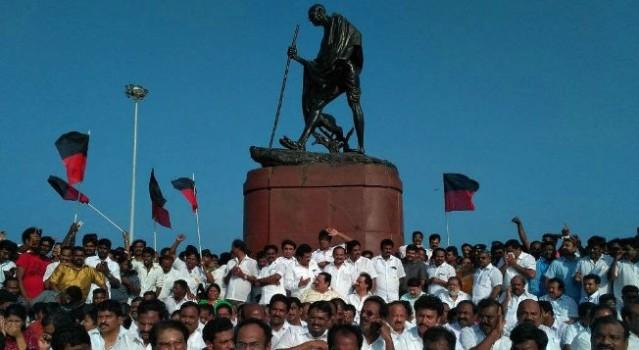 DMK Working President M.K. Stalin on Saturday sat in protest near the Mahatma Gandhi statue on Marina beach against the manner in which he and his party legislators were evicted from the state assembly. Earlier, he met Tamil Nadu Governor C. Vidyasagar Rao and lodged a complaint against the happenings in the assembly.