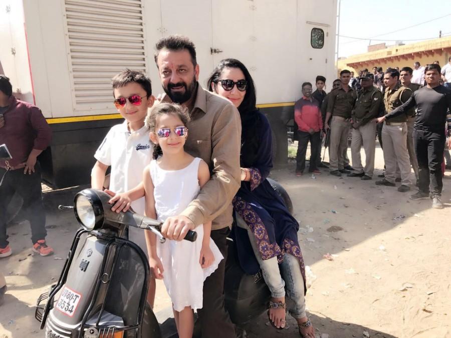 Bollywood actor Sanjay Dutt is not just enjoying the shooting of his comeback film "Bhoomi" here, but also the company of his wife Maanayata and their two children. Sanjay spent time with Maanayata and the children -- Sharaan and Iqra -- during the shoot of "Bhoomi", produced by Bhushan Kumar and Sandeep Singh, and directed by Omung Kumar. "Nothing compares to a simple ride on a scooter with the family... Exploring the lanes of Agra. Beautiful life, thank you god," Maanayata posted on her official Instagram page along with a photograph featuring the four of them on a scooter. The twins are seen dressed in white, while Sanjay is dressed in a simple shirt and pants. Maanayata is seen riding the pillion in a kurta with a pair of jeans. The image has a vanity van as its backdrop, with happy onlookers catching a glimpse of the Dutt family's joyful moment. Sanjay Dutt,actor Sanjay Dutt,Bhoomi,Maanayata,Sanjay Dutt pics,Sanjay Dutt images,Sanjay Dutt photos,Sanjay Dutt pictures