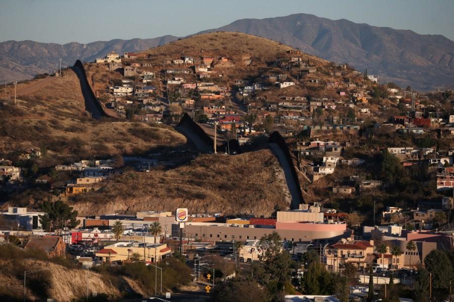 The U.S. border with Mexico is seen in Nogales, Arizona. "President Trump should take a good look at the effects of whatever he does, because he's going to end up with a real problem," said Nogales Mayor John Doyle, who joined other lawmakers from Arizona, New Mexico and Texas in denouncing the import tax plan in letters to U.S. lawmakers. U.S. border,U.S.,Mexican,Tomatoes,peppers,cucumbers,Nogales,Arizona
