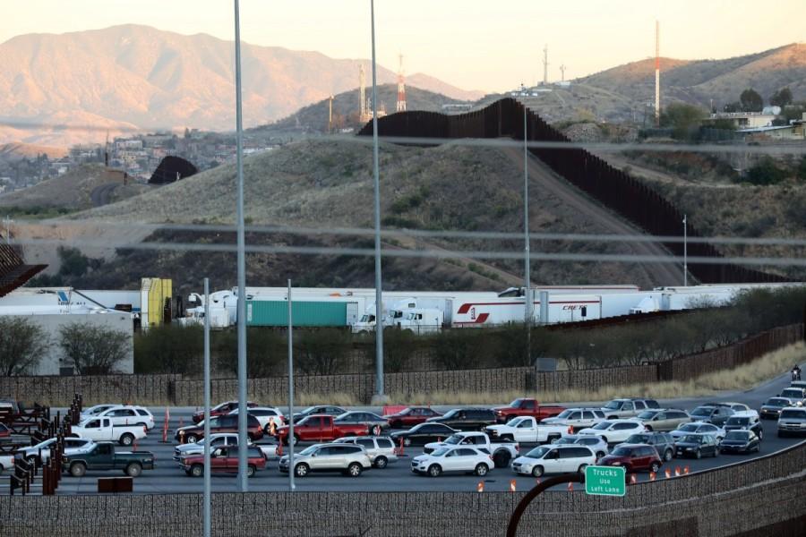 Trucks and cars cross the border from Mexico into the U.S. in Nogales, Arizona. U.S. border,U.S.,Mexican,Tomatoes,peppers,cucumbers,Nogales,Arizona
