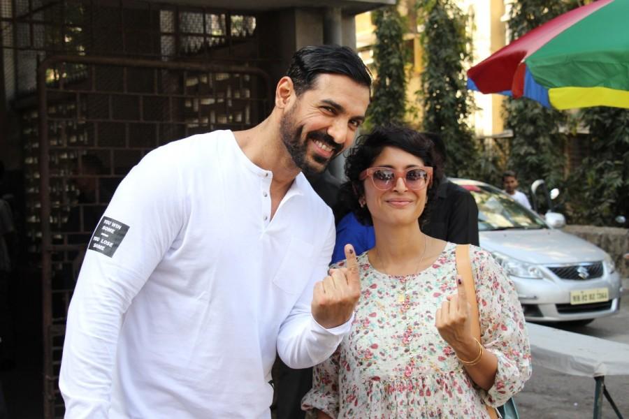 BMC Election 2017: Bollywood actor John Abraham and Aamir Khan's wife Kiran Rao cast their vote at St Anne's Church in Mumbai. John Abraham,Kiran Rao,BMC Election 2017,BMC Election,Aamir Khan,St Anne's Church