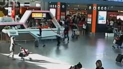 A still image from a CCTV footage appears to show (circled in red) a man purported to be Kim Jong Nam being accosted by a woman in a white shirt at Kuala Lumpur International Airport in Malaysia on February 13, 2017.