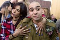 Israeli soldier Elor Azaria is embraced by his mother at the start of is sentencing hearing at a military court in Tel Aviv, Israel February 21, 2017.