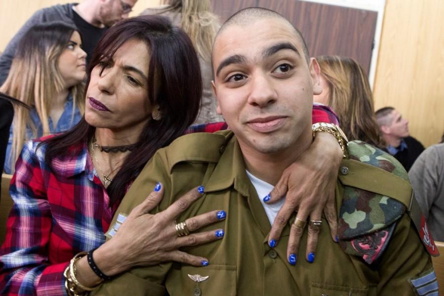 Israeli soldier Elor Azaria is embraced by his mother at the start of is sentencing hearing at a military court in Tel Aviv, Israel February 21, 2017. Israeli soldier,Palestinian assailant,killing Palestinian,Palestinian,Israeli soldier Elor Azaria,Elor Azaria