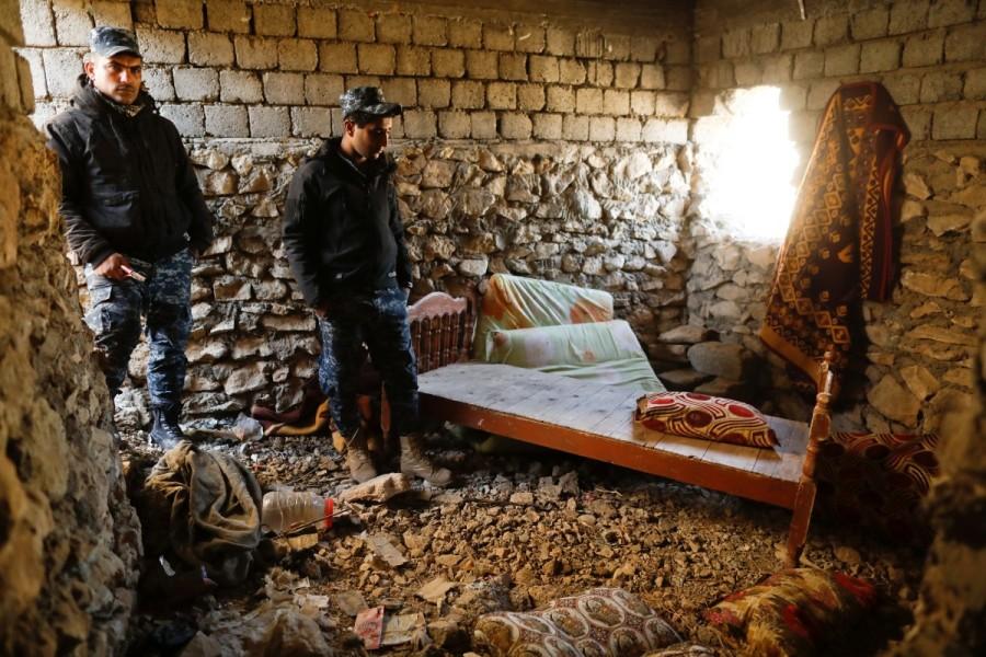 Federal police members stand inside a room where they said Islamic State sniper was hiding at a liberated part of Albu Saif village south of Mosul, Iraq February 21, 2017. Iraqi forces,Mosul,Iraqi forces push into Mosul,U.S.-backed Iraqi forces